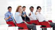 Foto: Business people with thumbs up at a conference Business people with thumbs up at a conference