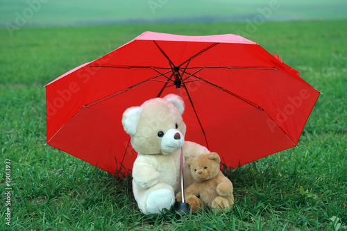 Photo: Two teddy bears under red umbrella Two teddy bears under red umbrella