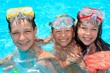 Three happy children in pool