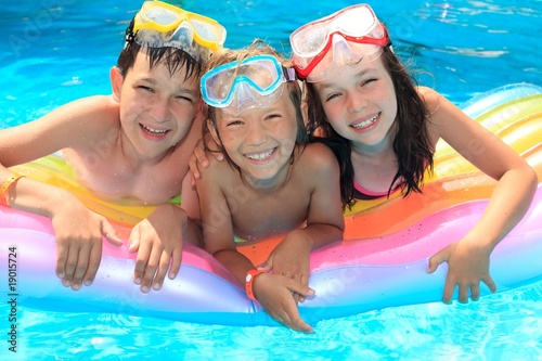 Photo: Smiling Children in Pool Smiling Children in Pool