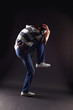 Hip hop man dancer against black background