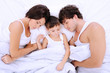 sleeping parents with little boy