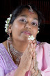 Namaste with a flower