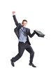 A happy young businessman jumping in the air A happy young businessman jumping in the air