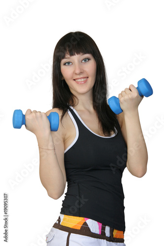 Photo: The girl with dumbbells The girl with dumbbells