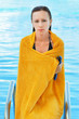 Pensive girl coming out from the swimming pool Pensive girl coming out from the swimming pool