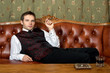 Young bussinesman smoking cigarette