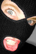 A stock photograph of an attractive woman wearing a balaclava.