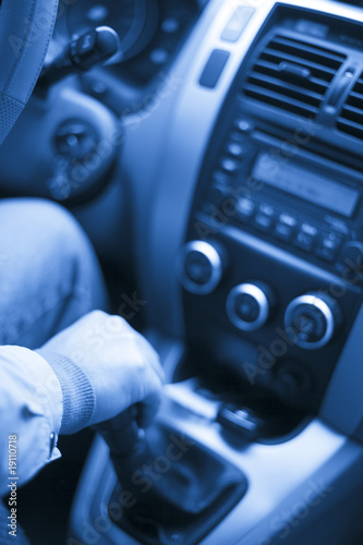Photo: the interior of a car. man driving on the road. the interior of a car. man driving on the road.