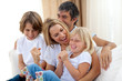 Happy family relaxing on the sofa