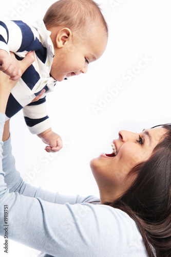 Photo: Mother lifting happy smiling baby Mother lifting happy smiling baby
