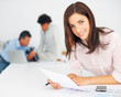 Pretty young magazine journalist at work