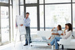 Mature magazine publisher presenting a plan to colleagues
