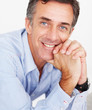 Closeup of a happy mature magazine editor while at work