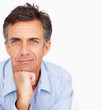 Mature business man with his hand on his chin isolated over whit