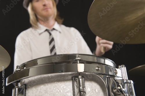 Photo: Young man plays the drums Young man plays the drums