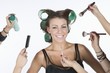 Woman in rollers , with cosmetics products on hand
