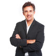 Professional mature businessman posing in black suit isolated