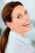 Happy young business woman at work