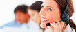 Portrait of a happy young customer representative wearing headse