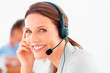 Closeup of a happy young customer representative wearing headset