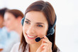 Portrait of a happy young customer representative wearing headse