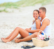 Young couple enjoying on the beach together