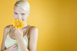 A Young Woman Holding An Orange Flower