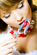 Photo: Girl eating candy Girl eating candy
