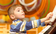 Boy plays piano