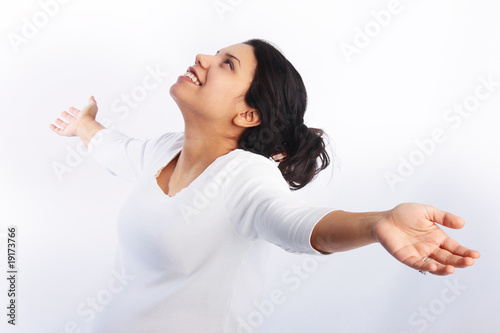 Photo: Woman praising with arms raised in the air Woman praising with arms raised in the air