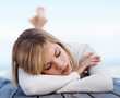 Cute young female sleeping on a porch , focus on face