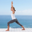 Fit young female stretching while on a porch