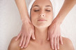 Top view of a woman getting a massage by a masseuse