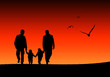 Familie im Sonnenuntergang
