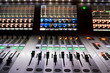 professional audio mixer in a recording studio