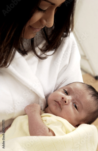 Photo: Hispanic mother holding infant Hispanic mother holding infant
