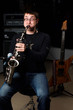 male play in study on saxophone