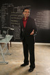 Hispanic Businessman Standing in front of Chalkboard Hispanic Businessman Standing in front of Chalkboard