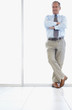 Full length of a old business man with hands folded