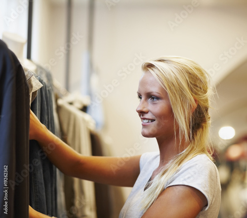 Photo: Woman in a clothes store Woman in a clothes store