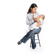 Mother bottle feeding baby infant