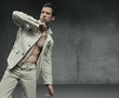 Elegant guy over grunge background
