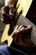 African American man playing guitar