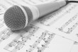 classical microphone on sheet of notes classical microphone on sheet of notes