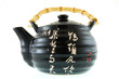 a black ceramic teapot