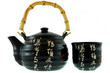 a black teapot with a cup