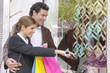 Young couple window shopping