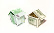 Housea made from euro and dollar bills on white background Housea made from euro and dollar bills on white background