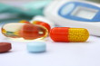 Multicolored pill with time release medicine on white